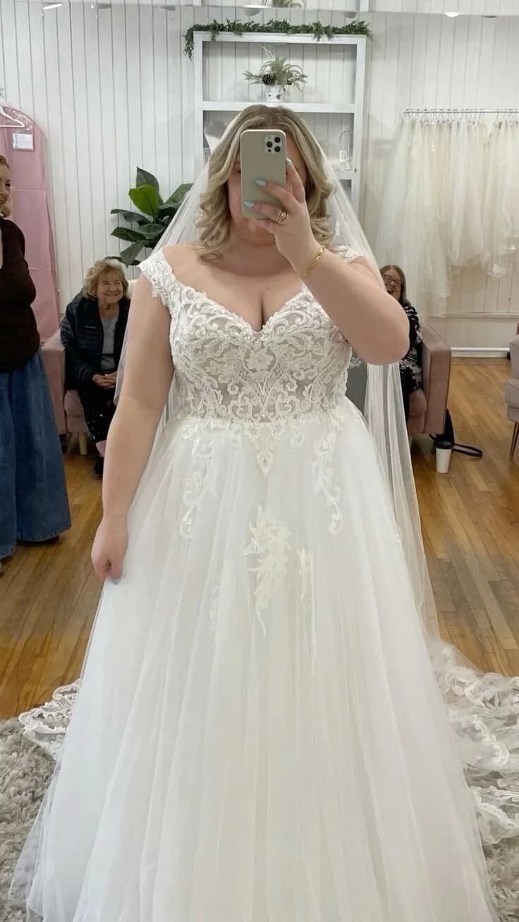 Ornate Sweetheart Neckline with Flowing Train